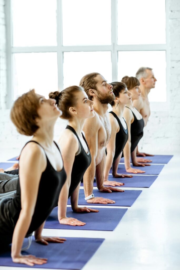 People practising yoga in the studio