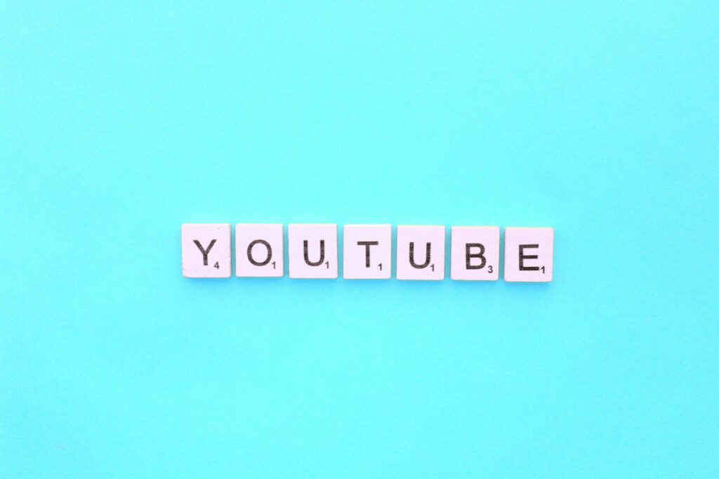 YouTube scrabble letters word on a light blue background